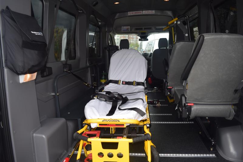 Medical stretcher in transportation van.